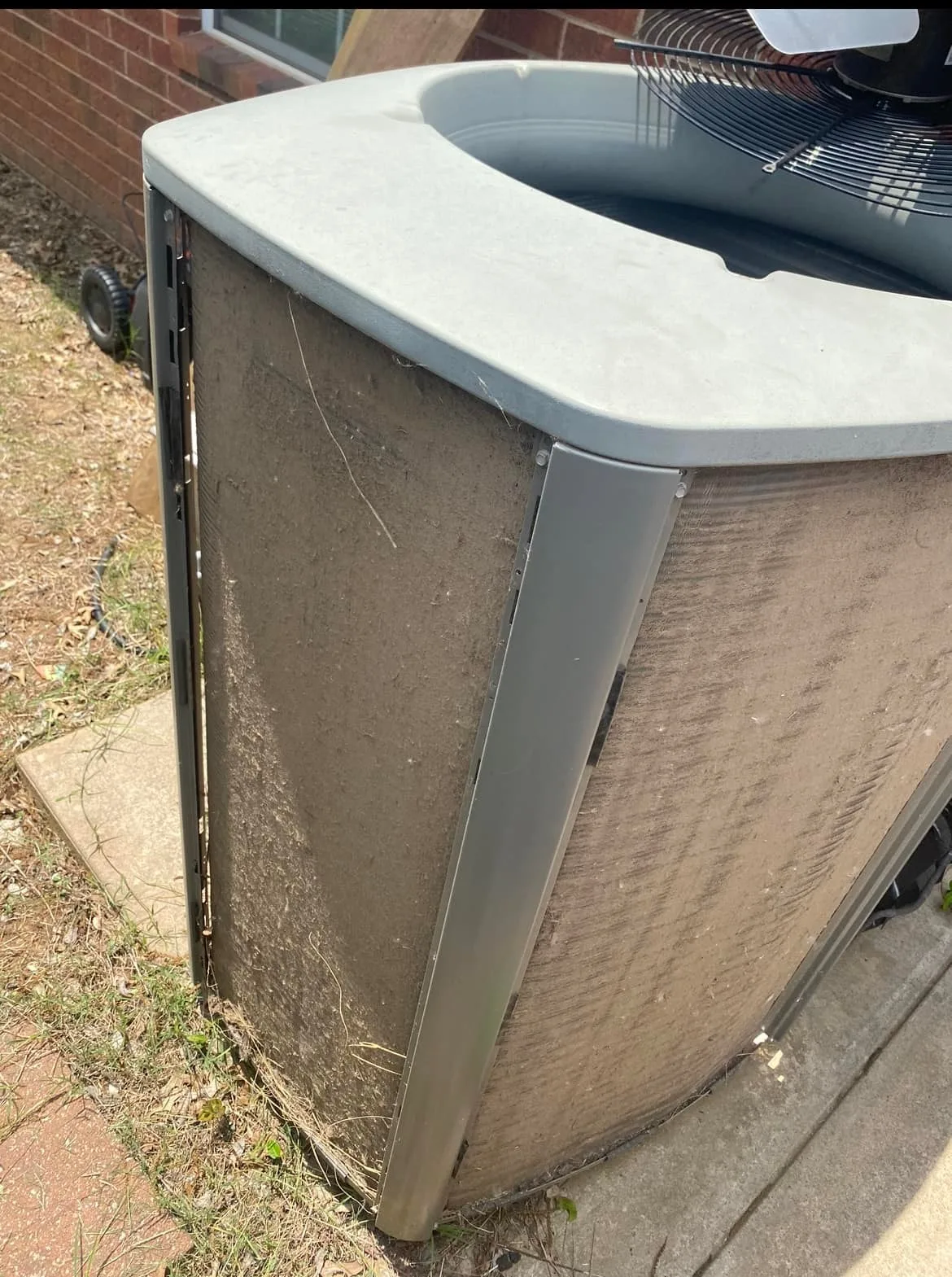 Filthy clogged outdoor AC unit needing maintenance in Perkins Oklahoma