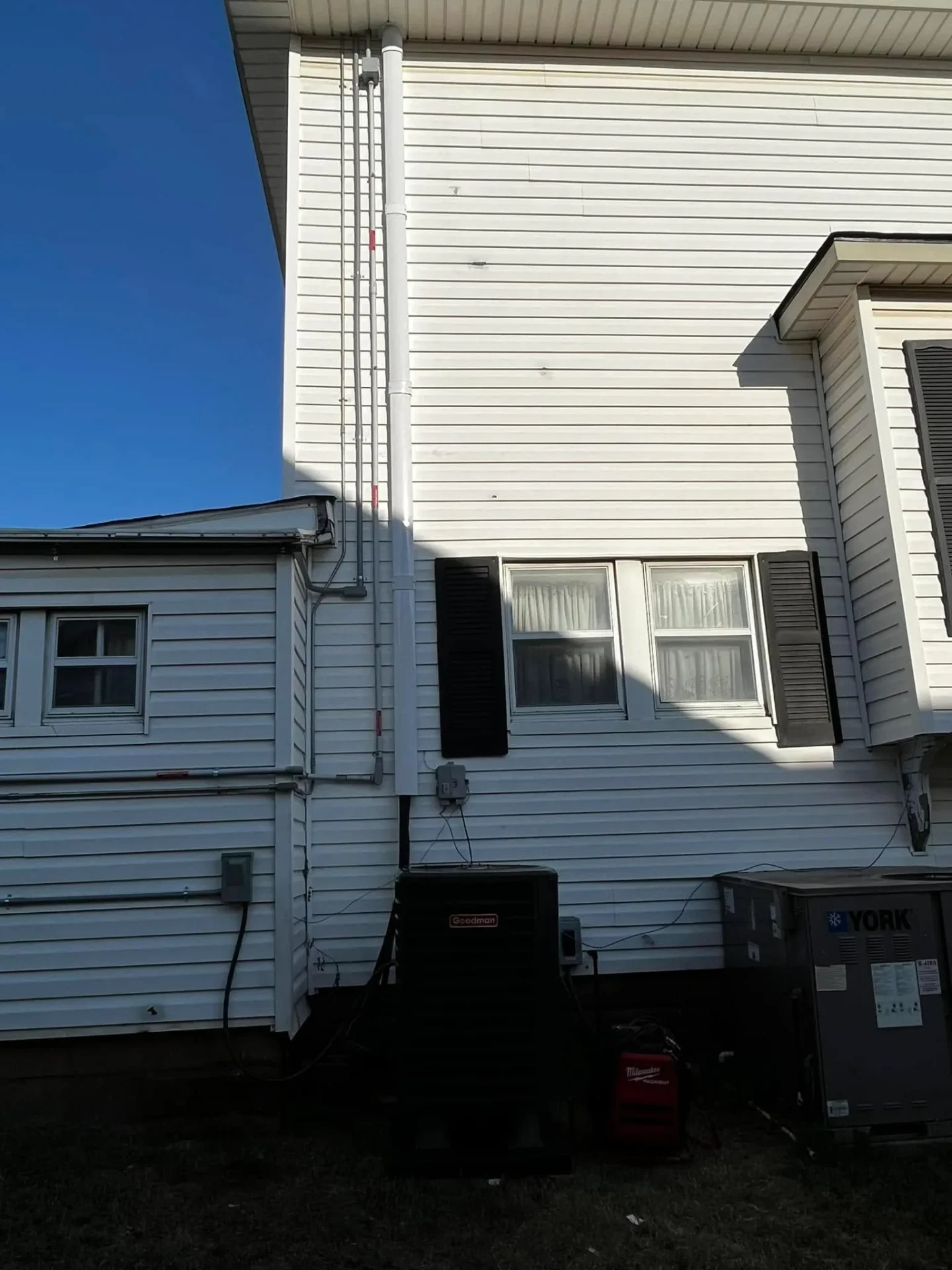 Exterior AC units and electrical conduit installation by Full Send