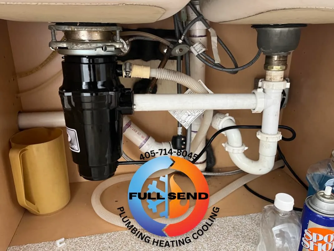 Garbage disposal installed under kitchen sink in Perkins Oklahoma