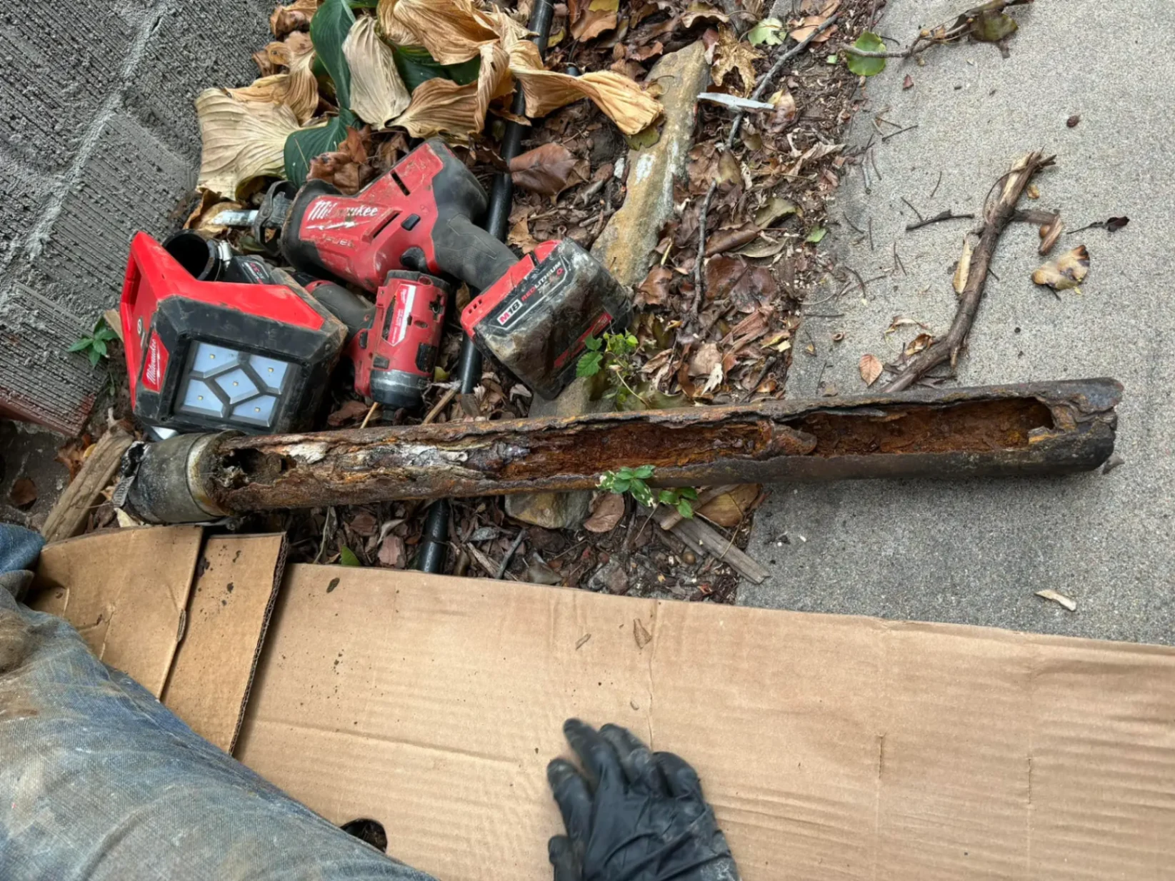 Rusted corroded pipe section found during water heater repair