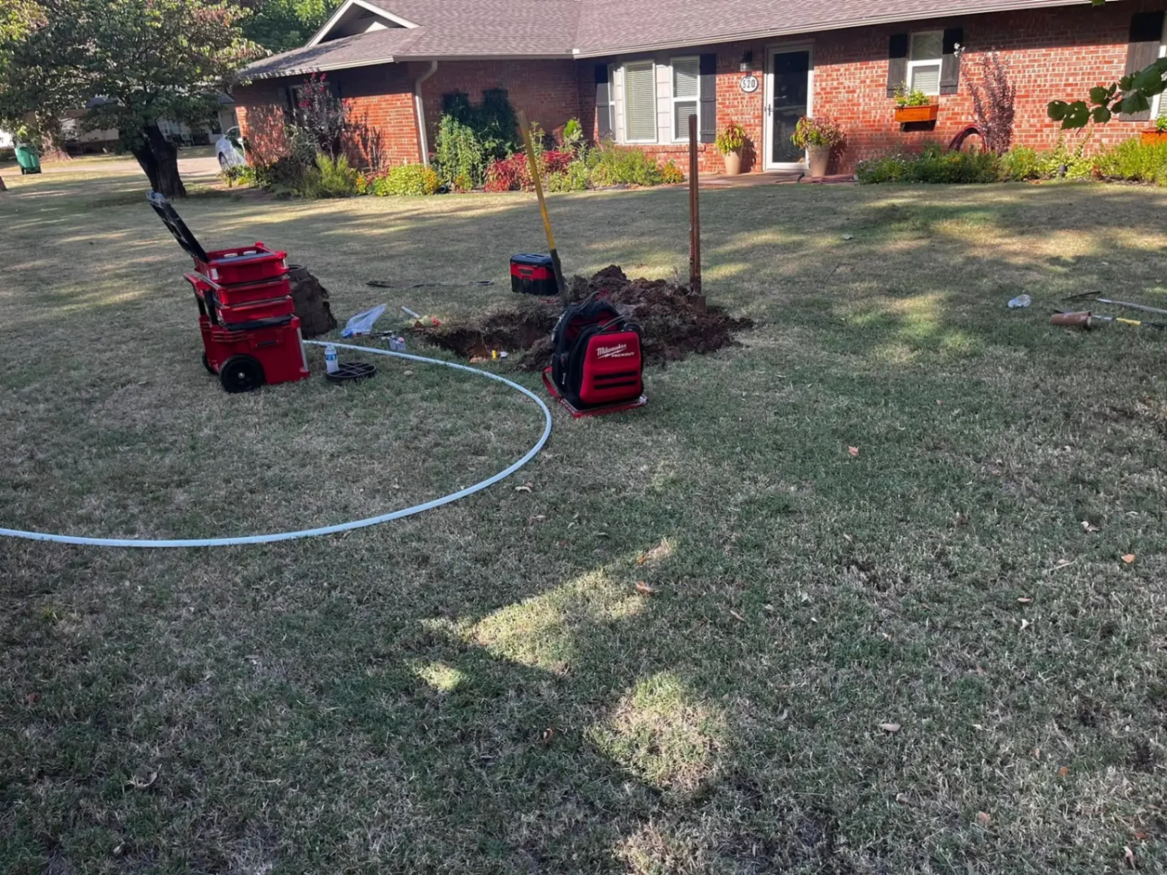 Water line repair trench with tools in Perkins OK